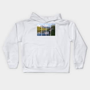 Wonderful landscapes in Norway. Nordland. Beautiful scenery of Thaihuset in a mountain valley. It is idyllically situated by a calm water. Mountains and trees in background. Sunset. Kids Hoodie